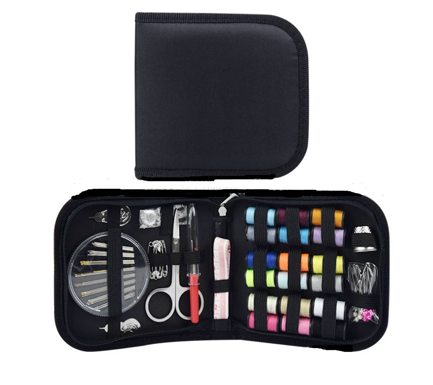 Sewing kit with various tools and threads in a black case on a white background